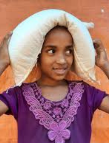 Rohingya Girl Carrying a bag of rice